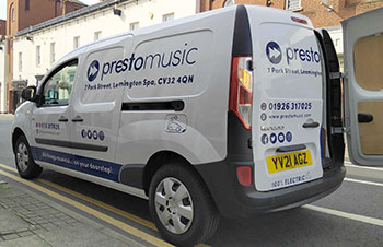 Our small van, showing the one hundred percent electric logo on the back and side.